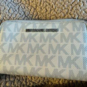 GUC Michael Kors light blue zip around wallet!  Has some wear on edges.